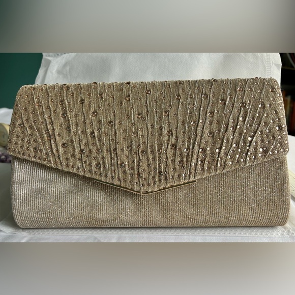 Large Champagne evening bag with detachable chain strap. It is 9 1/2”L x 5 1/2”W - Picture 1 of 4